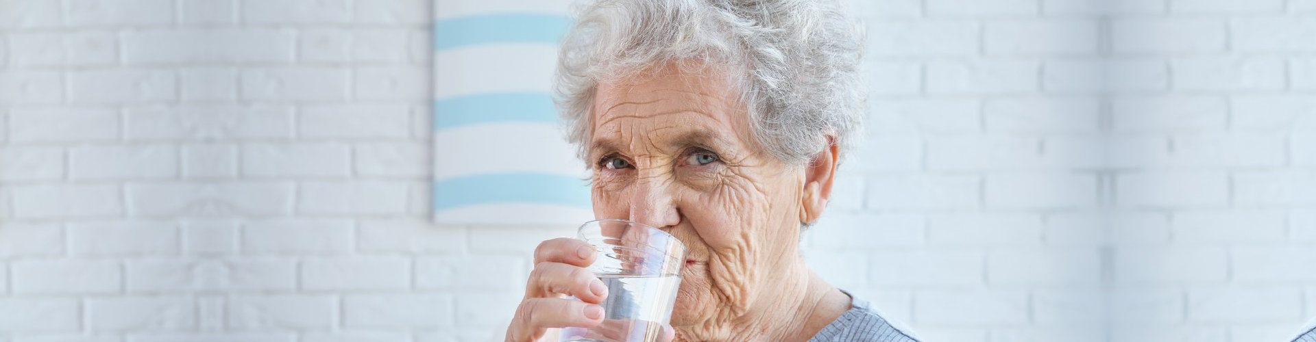 elderly woman drinking